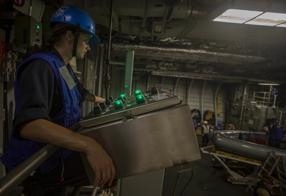 USS Billings Sailor Operates the Control Panel to Stern Door