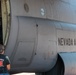 A CAL FIRE employee loads retardant into an Air National Guard C-130 from McClellan Air Tanker Base, Sacramento, Calif.