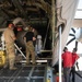 CAL FIRE employees load retardant into an Air National Guard C-130 from McClellan Air Tanker Base, Sacramento, Calif.