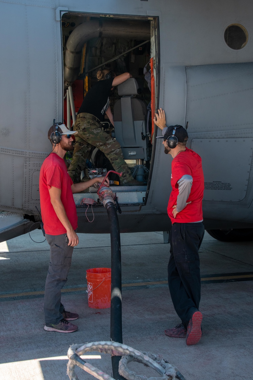 CAL FIRE employees load retardant into an Air National Guard C-130 from McClellan Air Tanker Base, Sacramento, Calif.
