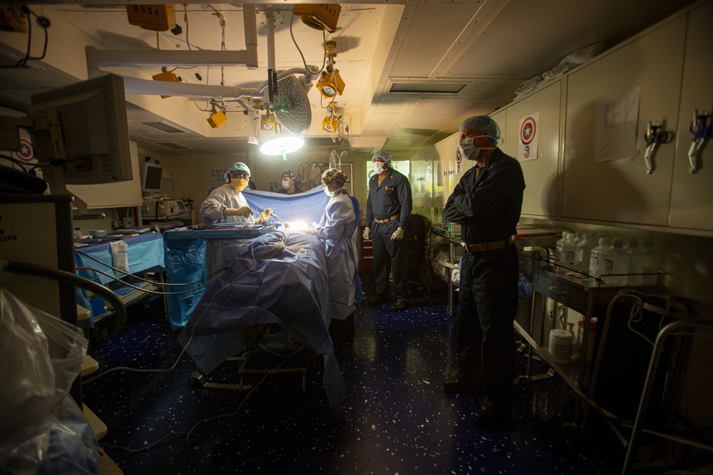 Surgical team conducts a laparoscopic appendectomy