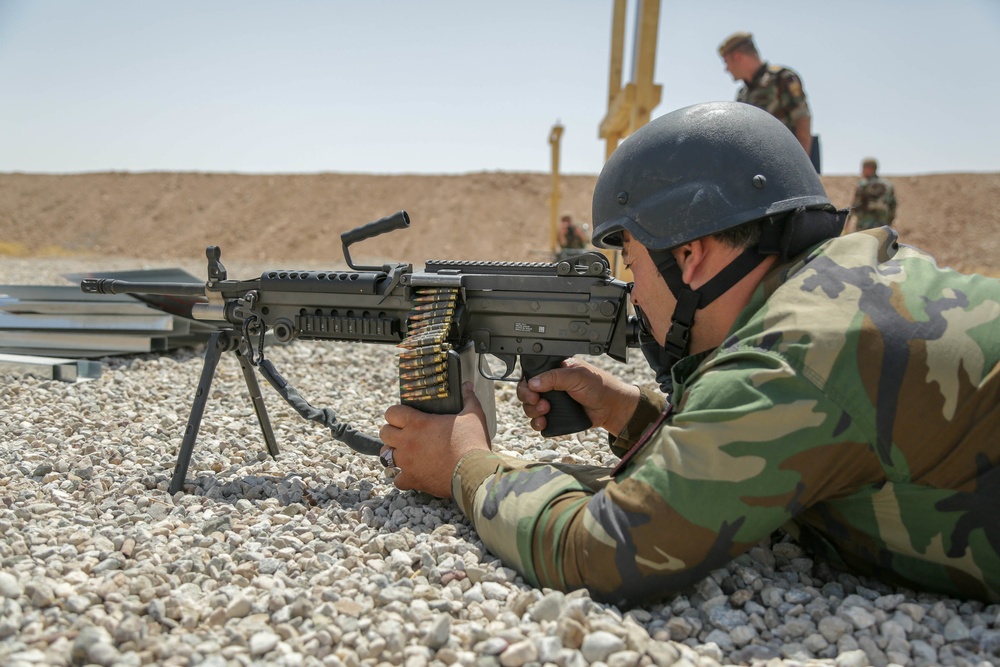 Peshmerga soldier conducts shooting training with an M249