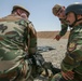 Peshmerga soldier conducts shooting training with an M249