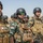 Peshmerga soldiers stand in formation