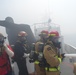 Coast Guard Cutter Benjamin crewmembers work to extinguish a vessel fire off the San Diego coast