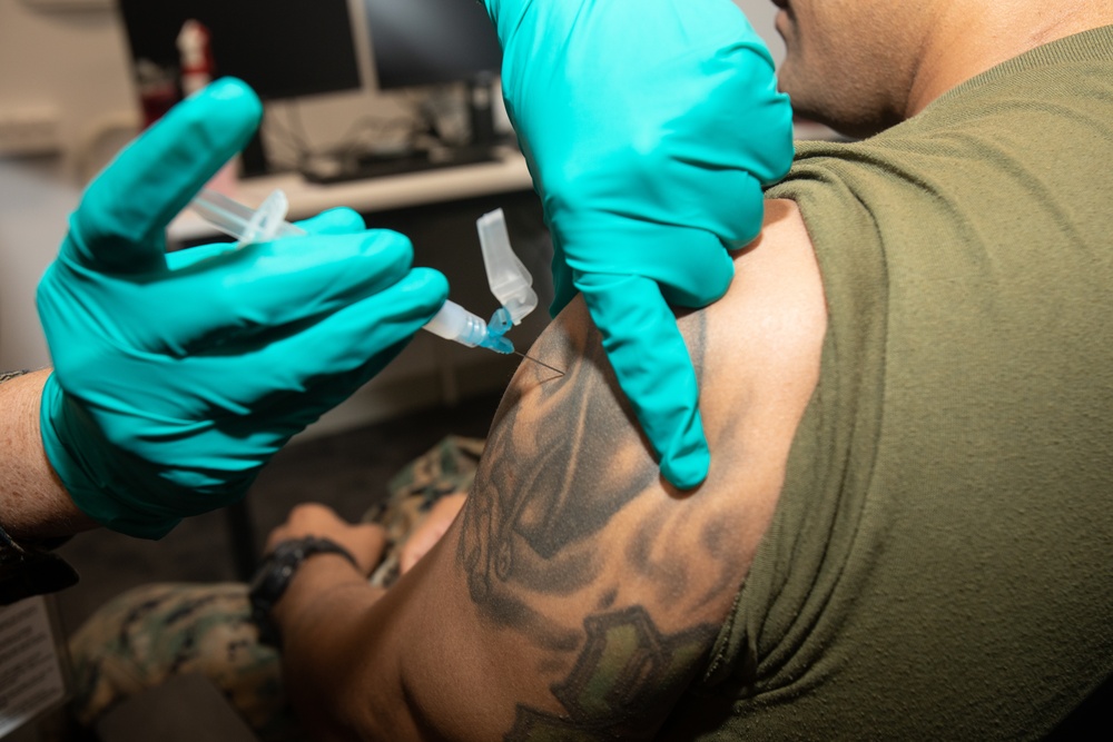 U.S. Navy Corpsmen with MRF-D administer influenza and COVID-19 vaccines