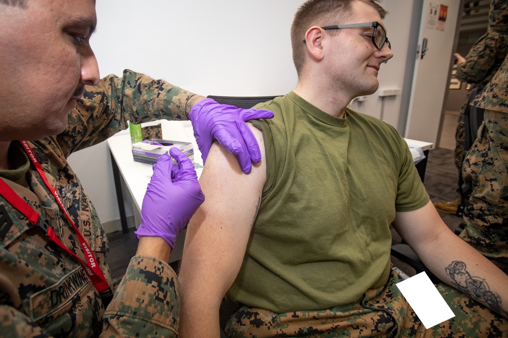 U.S. Navy Corpsmen with MRF-D administer influenza and COVID-19 vaccines
