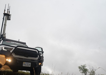 GIDE 3/ADE 5: Cell on light truck at Camp Grayling