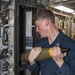 Gunner’s Mate 2nd Class Ryan Michael, from Shenandoah, Va., loads ammunition into the 5-inch gun