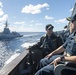 Cmdr. J.J. Murawski (front), commanding officer and Cmdr. Charles Cooper (back), executive officer USS Rafael Peralta (DDG 115) as they sail alongside HMAS Brisbane (FFH 41)