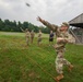 Maj. James Fink throws practice grenade