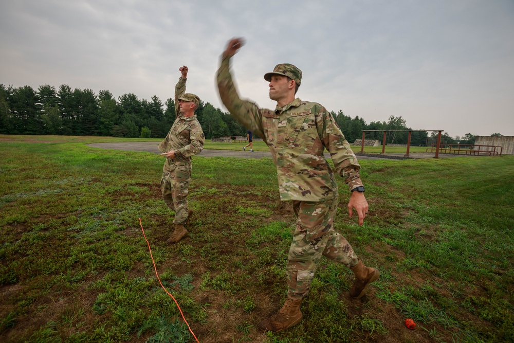 Staff Sgt. Trevor Thompson and  Sgt. Michael Yarrington throw practice grenade