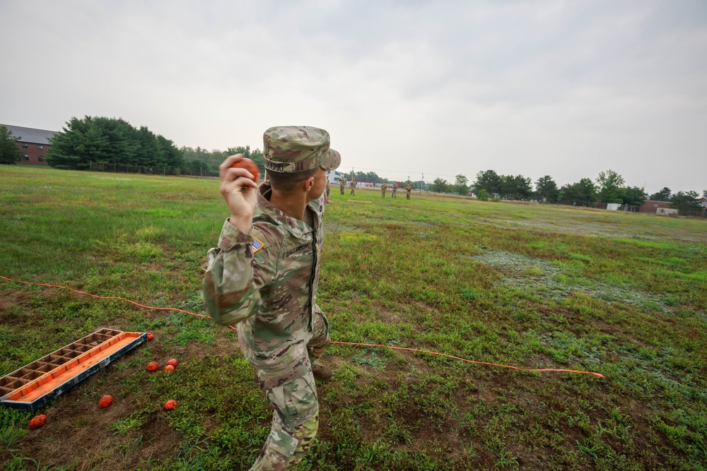 Maj. Nicole Dallocchio throws practice grenade