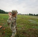 Maj. Nicole Dallocchio throws practice grenade