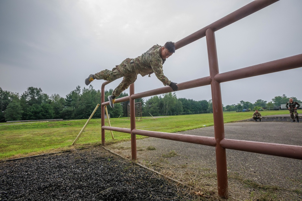 Maj. Nicole Dallocchio maneuvers over an obstacle