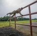 Maj. Nicole Dallocchio maneuvers over an obstacle