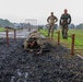 Staff Sgt. Trevor Thompson navigates under an obstacle