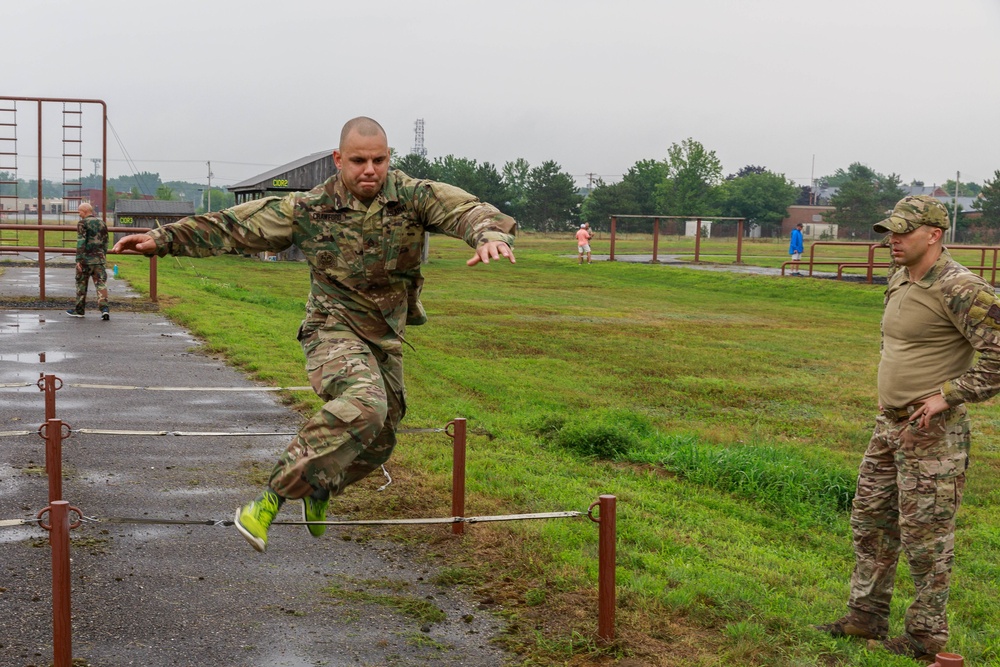 Staff Sgt. Devin Crawford jumps over an obstacle