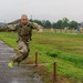 Staff Sgt. Devin Crawford jumps over an obstacle