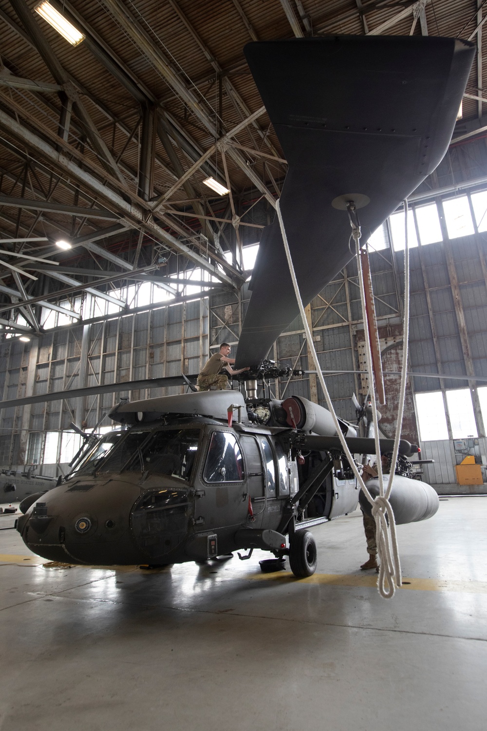 Marne Air Soldiers conduct maintenance on a UH-60 Black Hawk helicopter.