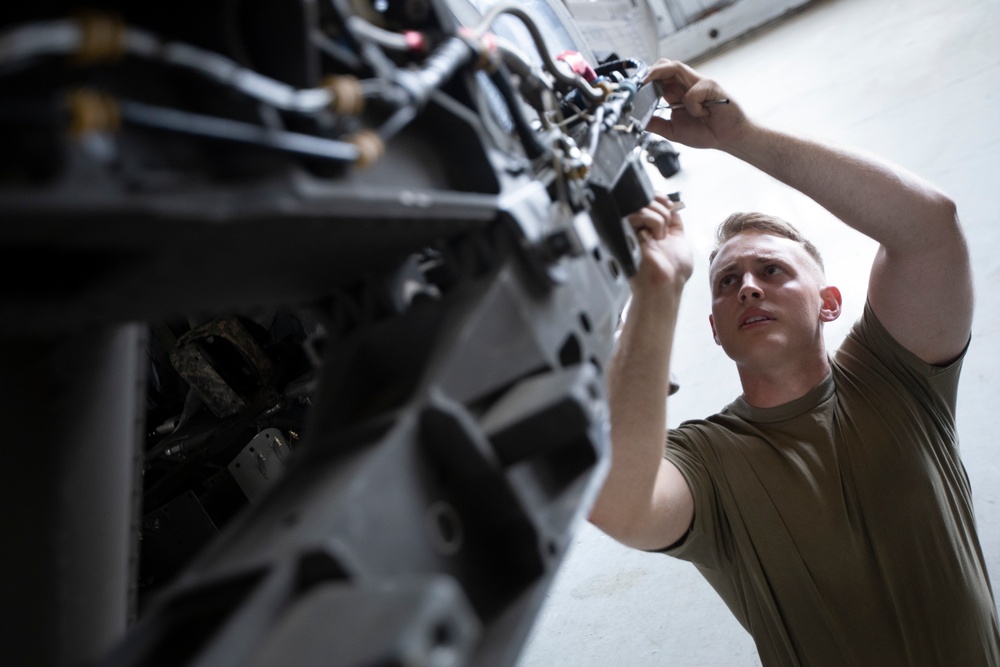 Marne Air Soldiers conduct maintenance on a UH-60 Black Hawk helicopter.