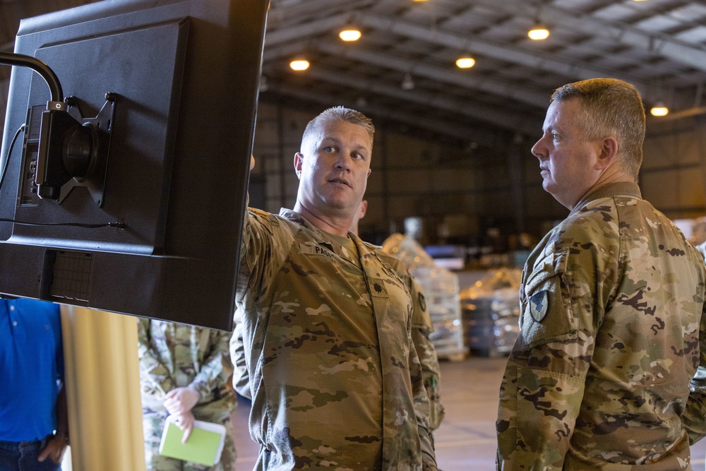 MG Mohan (right) receives a briefing from LTC Timothy Page during a visit to the 402nd Army Field Support Battalion