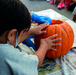 Bechtel ES parents share Halloween culture with local daycare, carve jack-o'-lantern