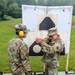 Lt. Col. Daryl Remick teaches Staff Sgt. Trevor Thompson  pistol shooting techniques