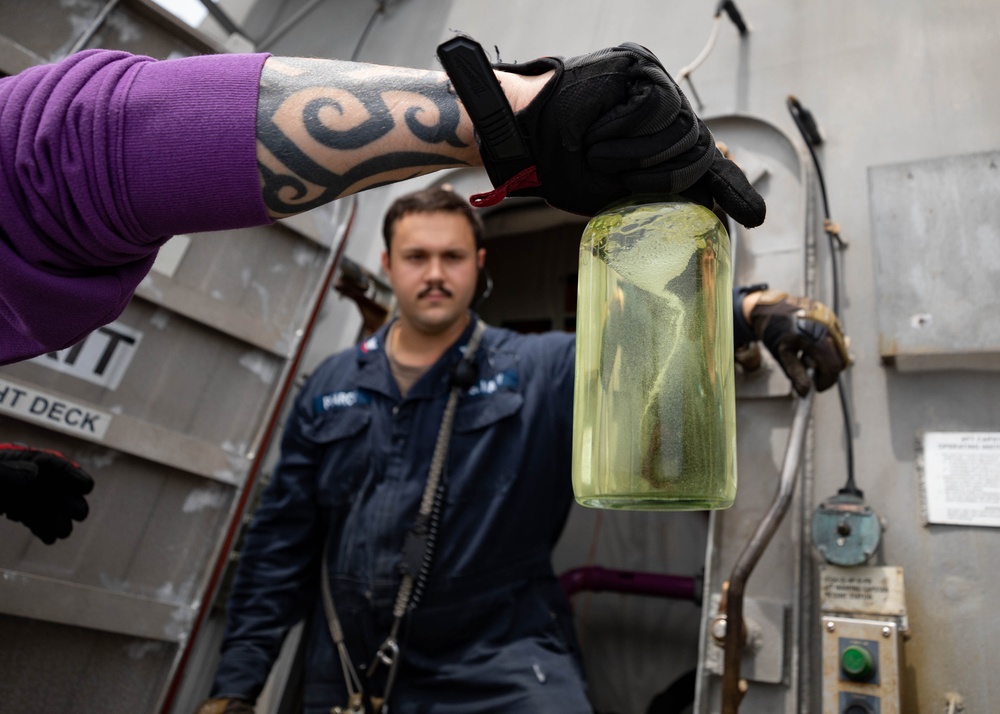 USS Sioux City Sailors Tests a Fuel Sample