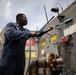 USS Sioux City Sailor Conducts a Freshwater Washdown