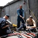 USS Sioux City Sailors Connect the Ship to Shore Power