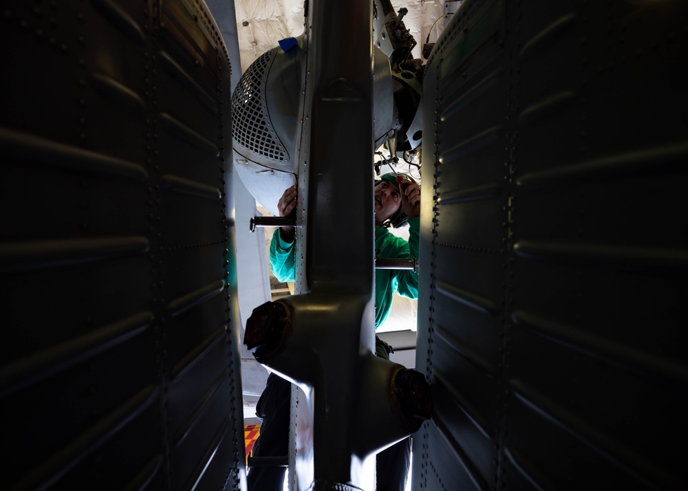 HSC 22 Sailor Conducts Maintenance on an MH-60S Seahawk