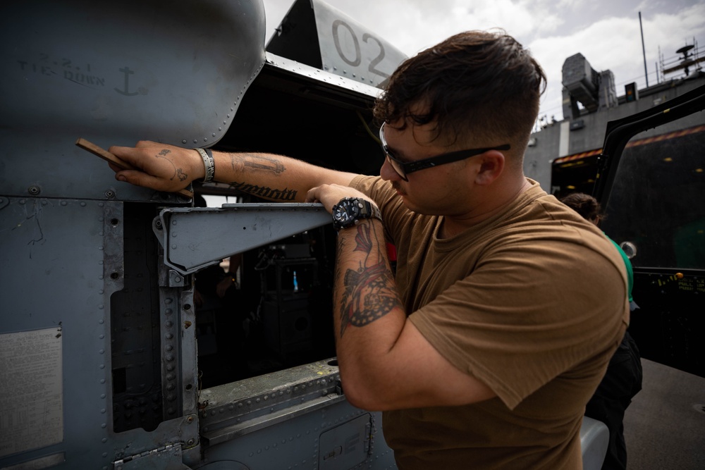 HSC 22 Sailor Conducts Maintenance on an MH-60S Seahawk