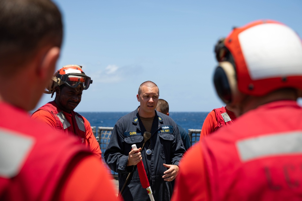 USS Sioux City Sailor Conducts a Debrief