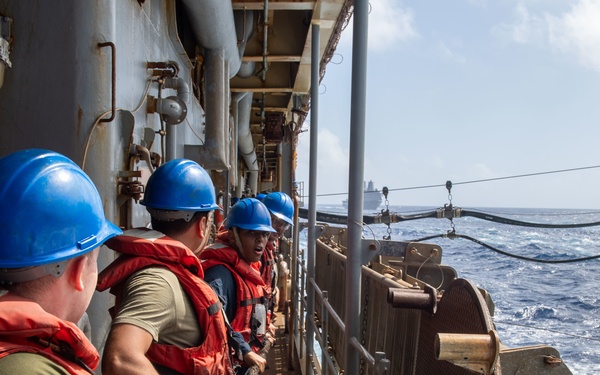 USS Germantown sailors heave messenger line.