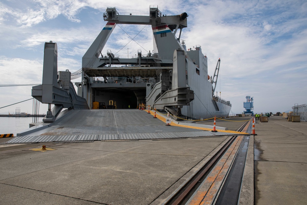 Personnel with the 836th Transport Battalion load cargo onto USNS Fisher