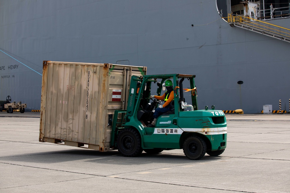 Personnel with the 836th Transport Battalion load cargo onto USNS Fisher