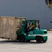 Personnel with the 836th Transport Battalion load cargo onto USNS Fisher