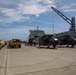 Personnel with the 836th Transport Battalion load cargo onto USNS Fisher