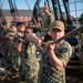 U.S. Sailors set spanker sail