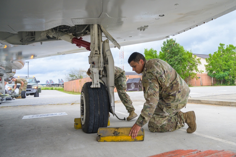 Team JSTARS maintainers tow an F-4C Phantom II to wing HQ for permanent static display