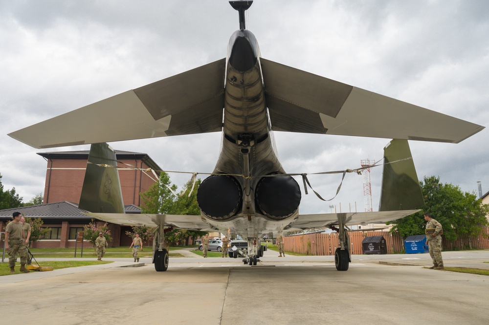 Team JSTARS maintainers tow an F-4C Phantom II to wing HQ for permanent static display