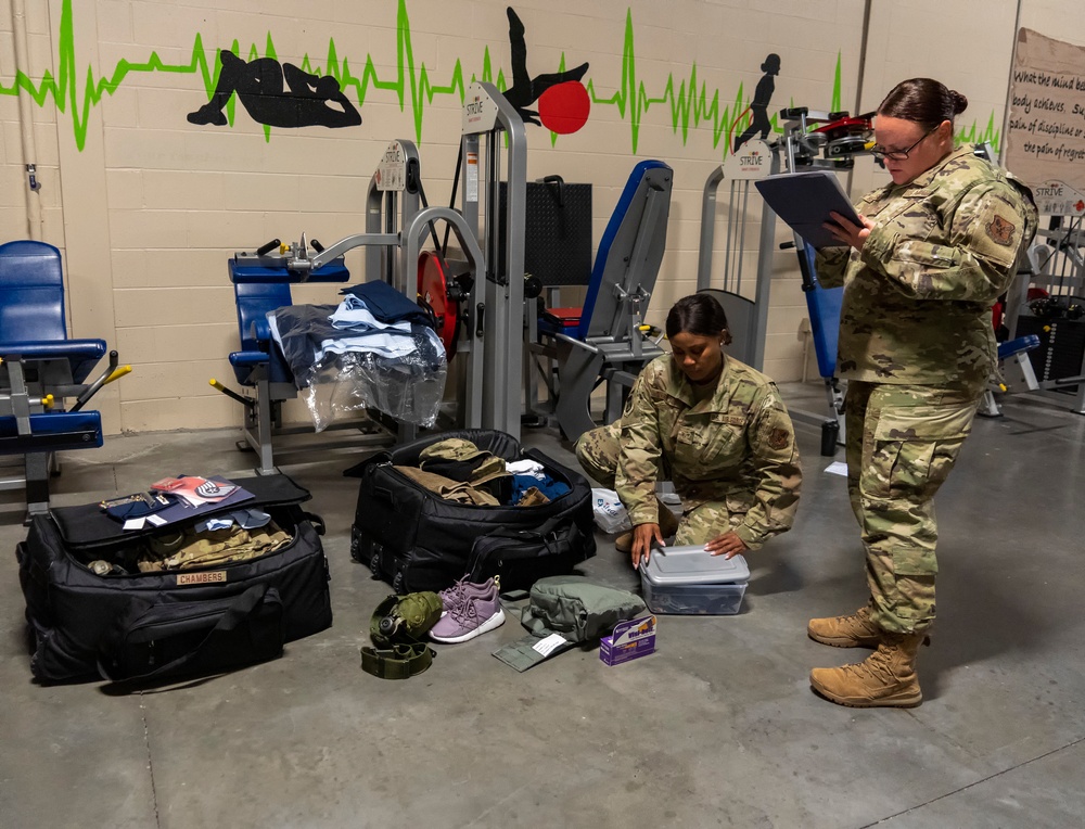 Deployed Airman complete mobility bag check