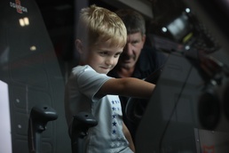 Firefighters at Camp Ripley give Ethan Manson firetruck tour