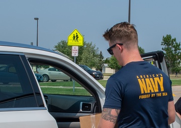 Sailors Hand Out Pre-packed Lunches during Fargo Navy Week