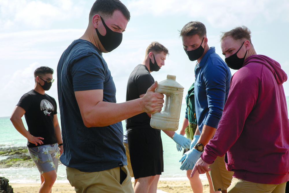 Marines wipe out trash in hidden beach