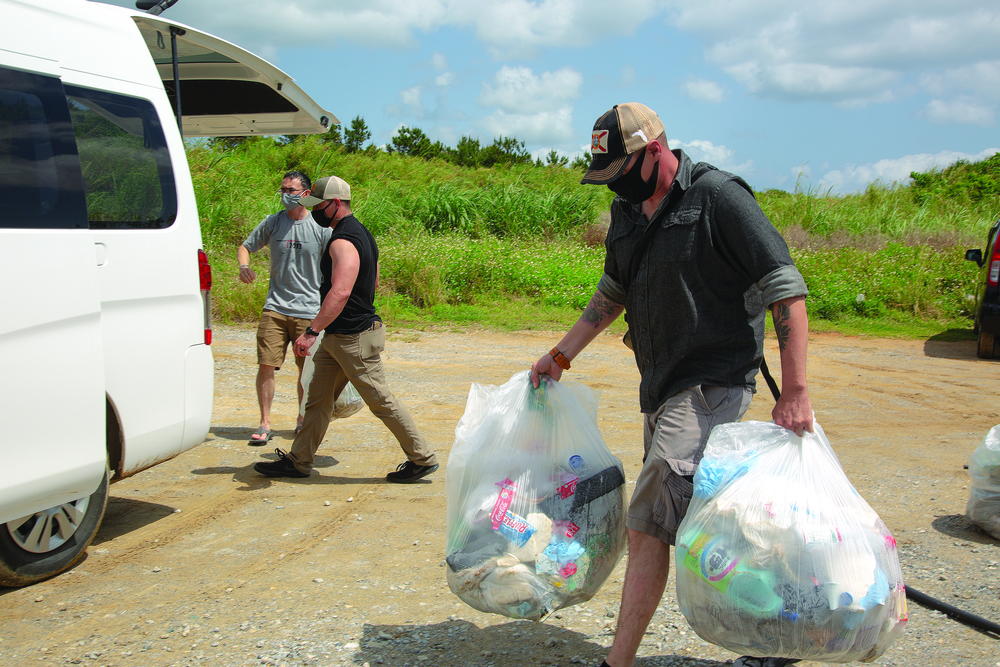 Marines wipe out trash in hidden beach