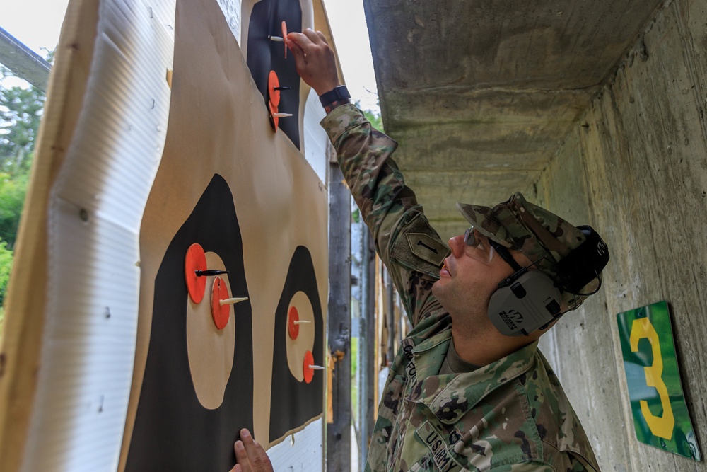 Staff Sgt. Devin Crawford marks hits after an M4 rifle firing event