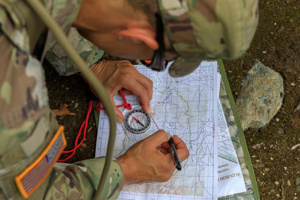Maj. Nicole Dallocchio plots a point on the map