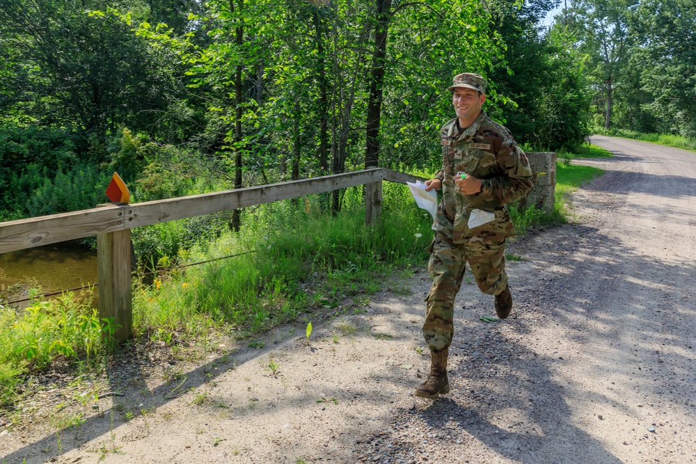 Staff Sgt. Trevor Thompson runs towards a marker